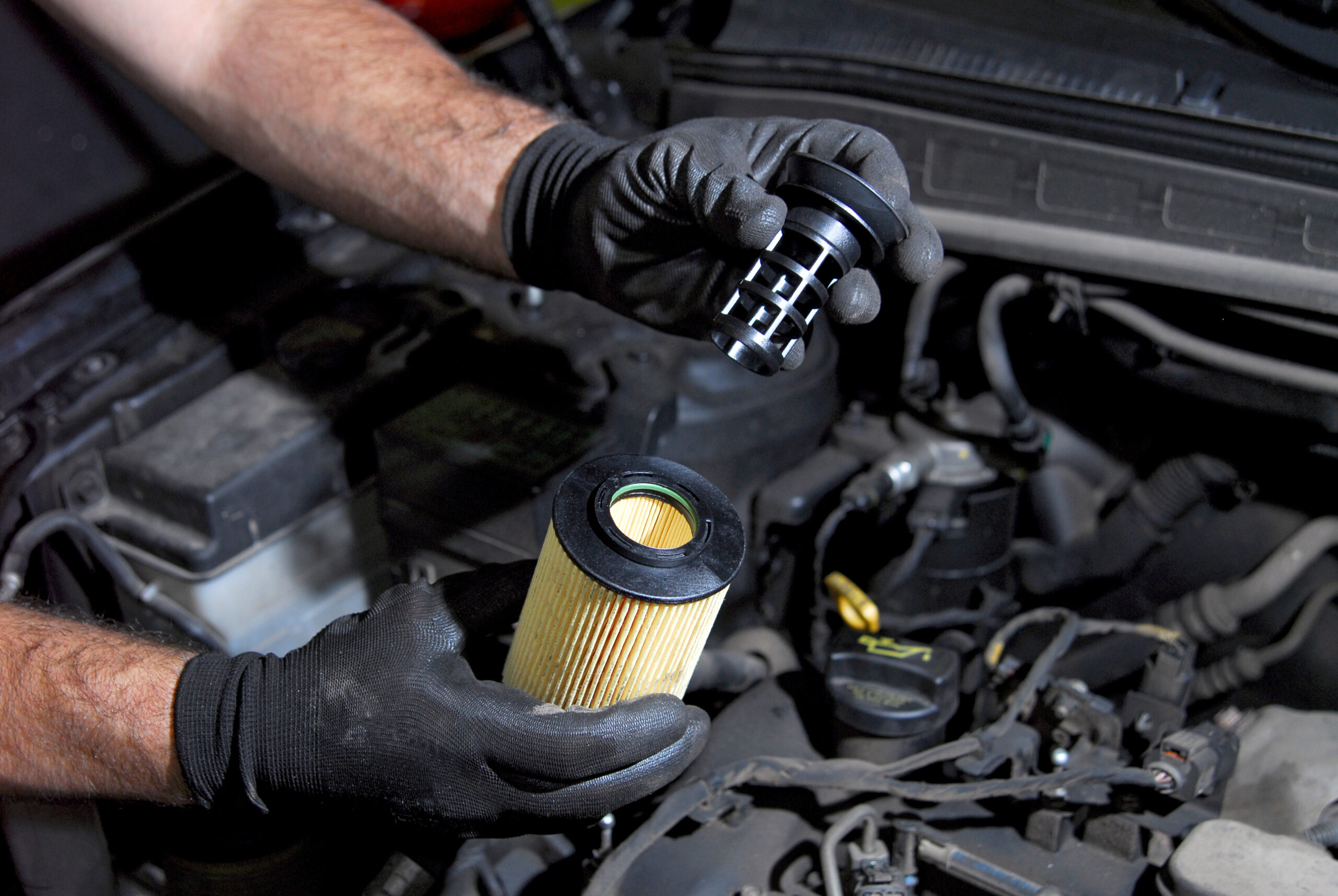 Mechanic replacing oil filter